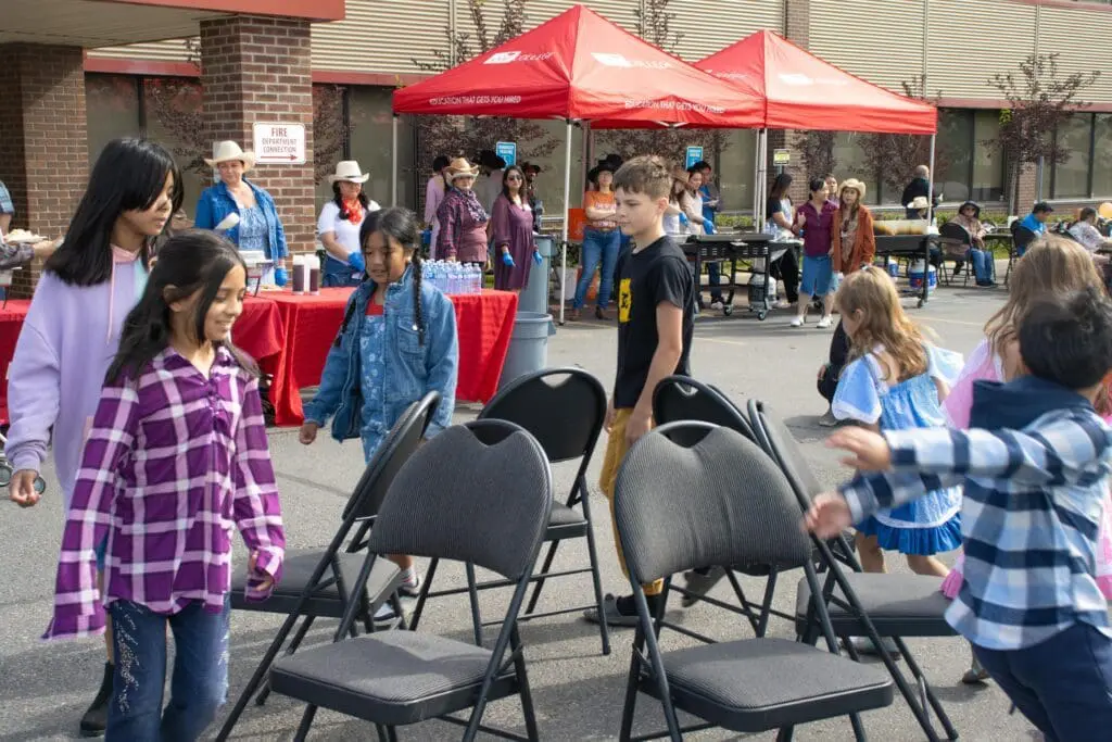 Kids enjoying game at stampede breakfast at abm college