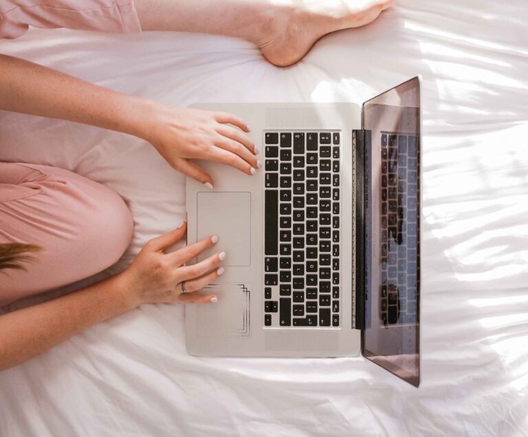 a woman working on her laptop