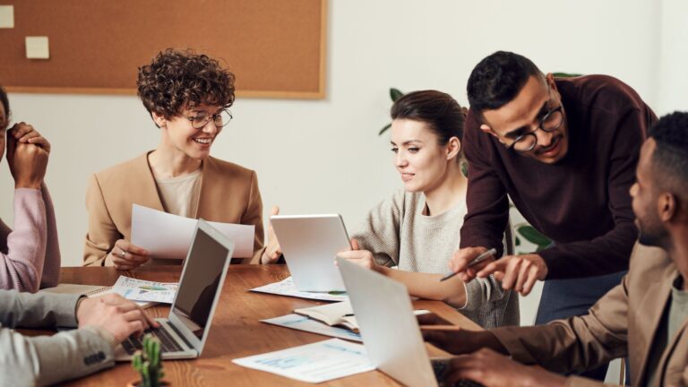 a group of people in suits working together on business