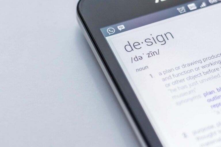 an image showing the corner of a phone that shows the definition of the word design