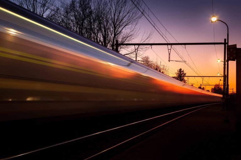 an image of fast moving train at evening