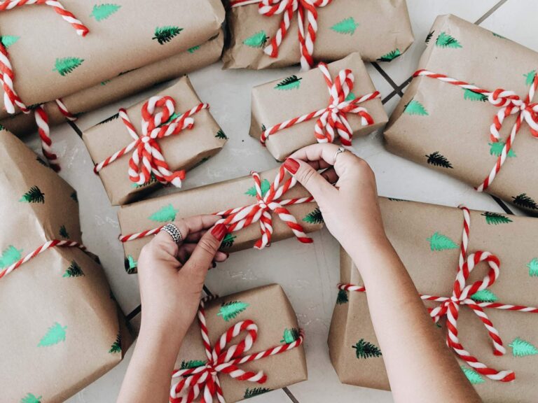 a person wrapping presents for Christmas