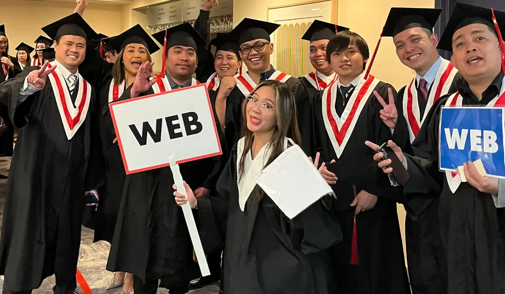 a group of people posing for picture in graduation gowns and caps