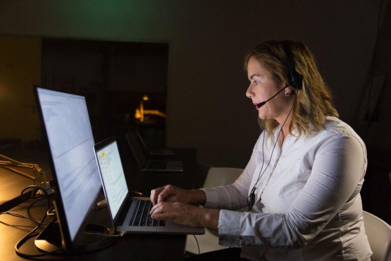 Female Help Desk Analyst while working