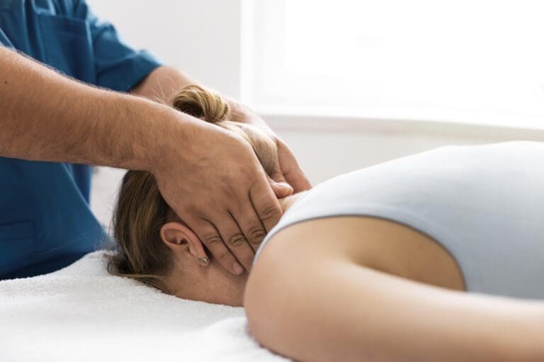 Massage therapy- Therapist doing massage on a female client