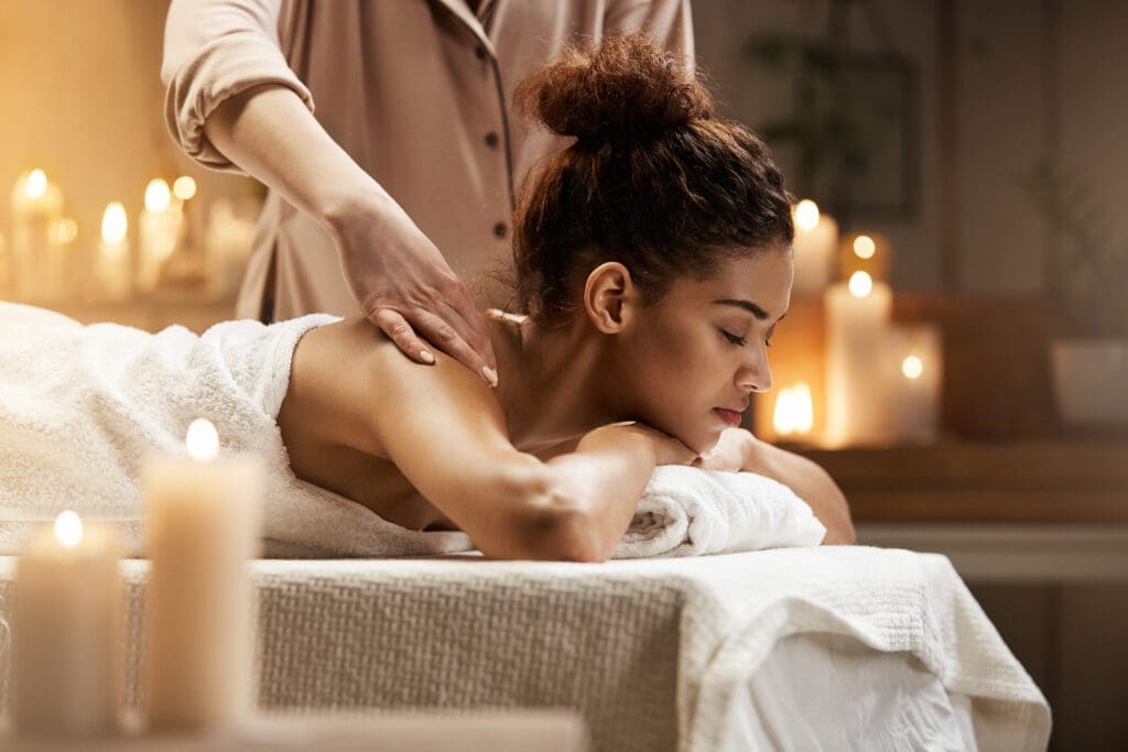 Massage Therapist doing Massage on african girl