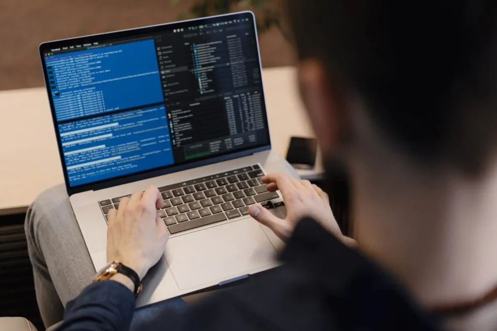 a man working on a web design and development diploma