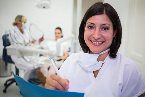 Female Dental Office Administrator working in a clinic
