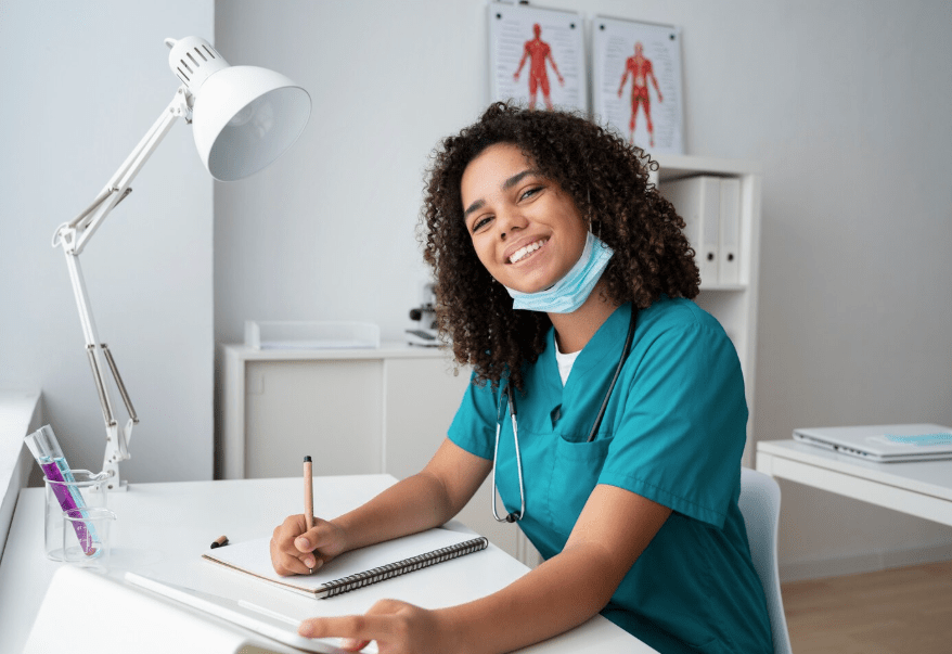 Happy medical office assistant and unit clerk while working