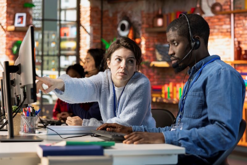 IT Help Desk Support Team diagnosing a client system remotely