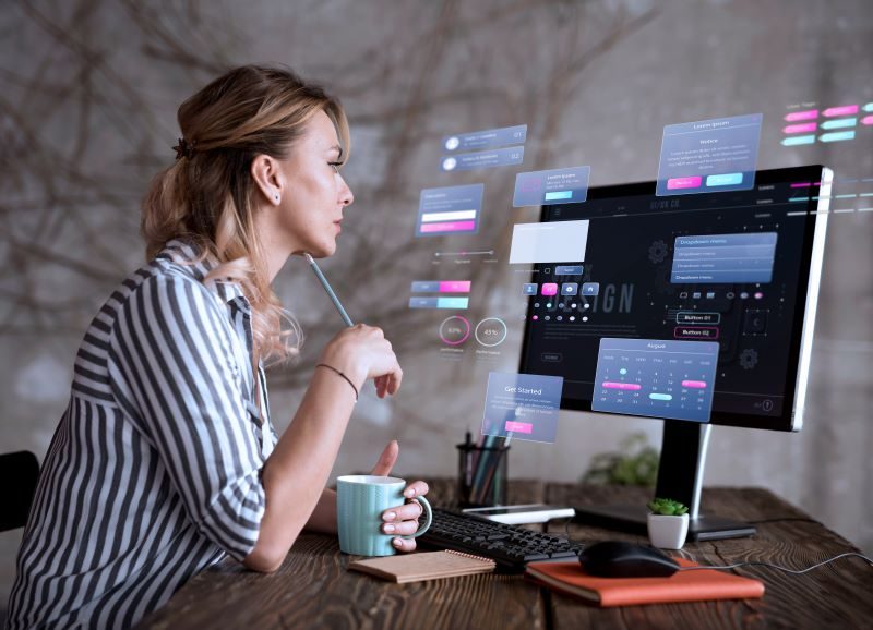 A female web designer deciding on the best layout for the new website