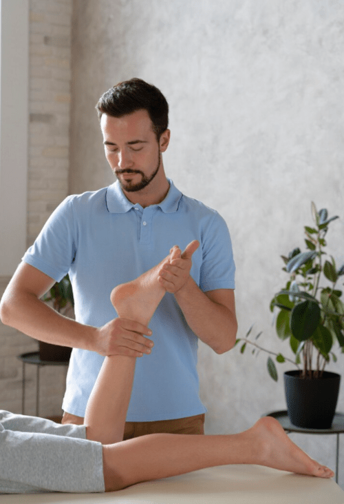 Male physiotherapist while wo king in his clinic